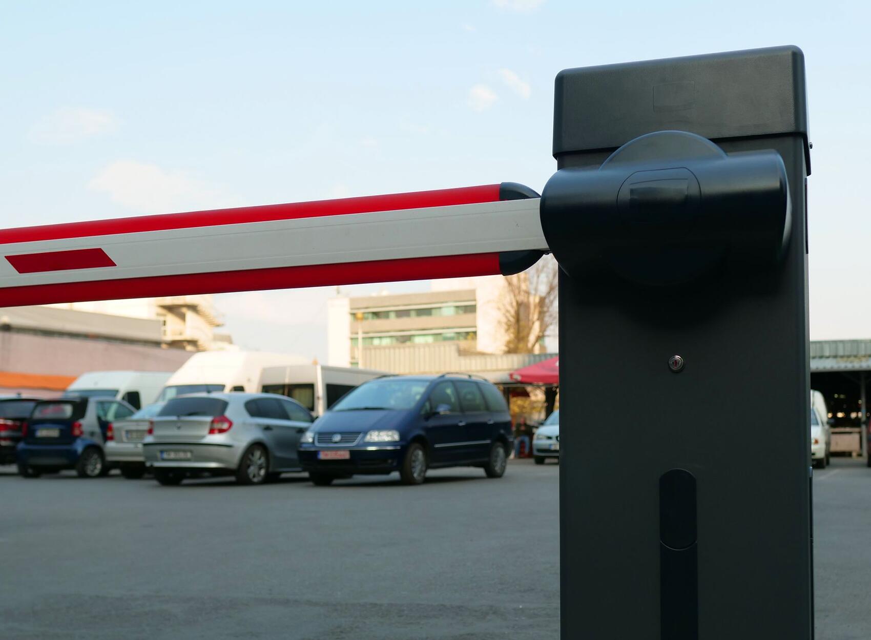 A boom barrier controlling vehicles at an entrance